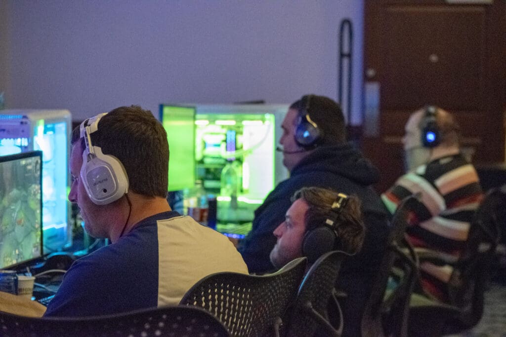 Different people playing games at the LAN.